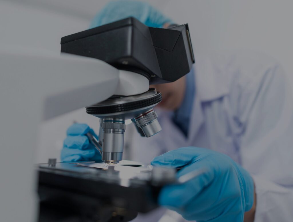 A researcher uses a microscope