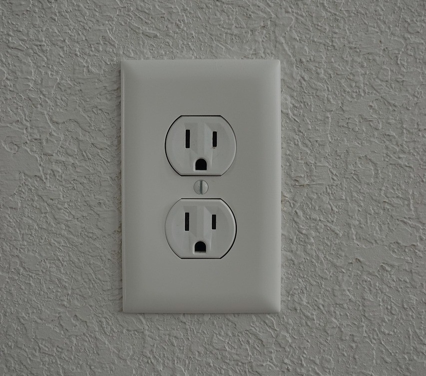 A photo of a typical wall socket.
